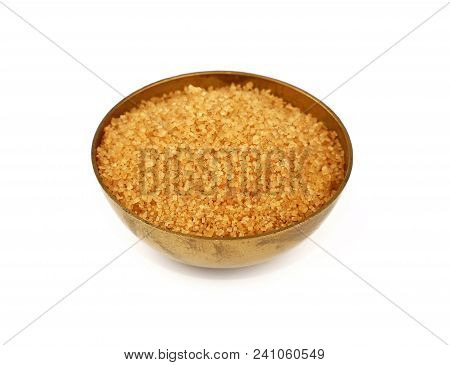 Close Up One Vintage Bronze Metal Bowl Full Of Raw Brown Cane Sugar, Isolated On White Background, H