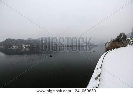 Winter Landscape With Snow And Lake Called Lago Di Fimon In Northern Italy