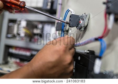 Electricians Hands Repair Switches In Electric Control
