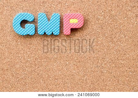 Color Toy Foam Alphabet In Word Gmp (abbreviation Of Good Manufacturing Practice) On Cork Board Back