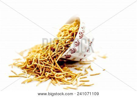Popular Indian & Gujarati Dish Aloo Sev Or Potato Sev Or Mint Flavored Sev In A Bowl Isolated On Whi