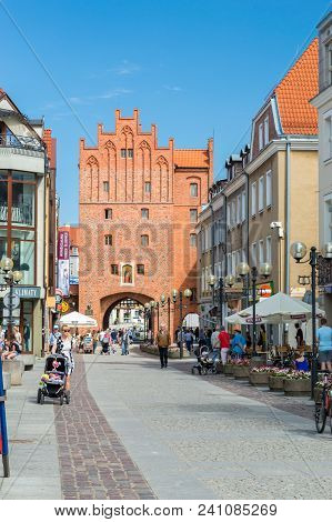 Olsztyn, Poland - May 1, 2018: High Gate With People In Old Town Of Olsztyn.