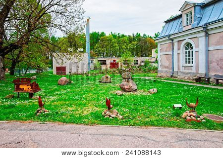 Rusty Metal Figures In Traku Voke Public Park In Vilnius, Lithuania.