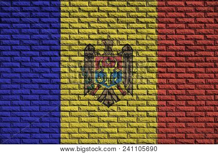 Moldova Flag Is Painted Onto An Old Brick Wall