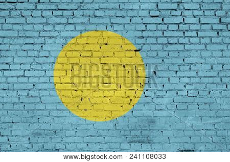 Palau Flag Is Painted Onto An Old Brick Wall