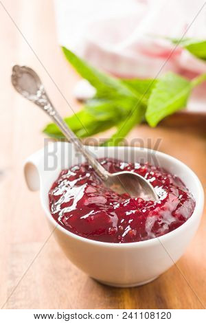 Raspberry jam jelly in bowl.
