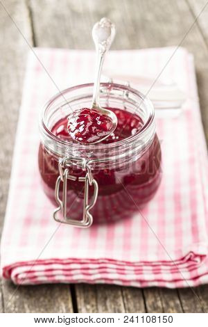 Raspberry jam jelly in jar.