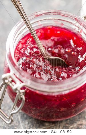 Raspberry jam jelly in jar.