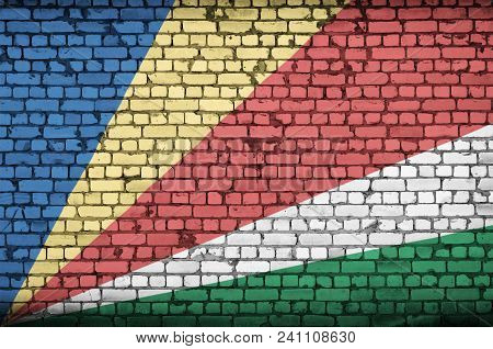 Seychelles Flag Is Painted Onto An Old Brick Wall