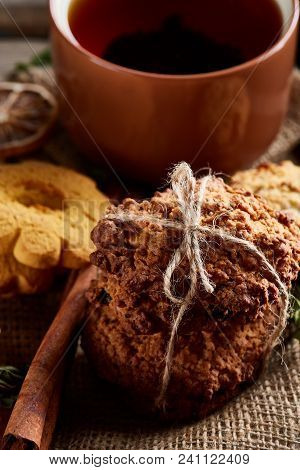 Cookies With Cinnamon And Tea On A Burlap Napkin, Selective Focus, Close-up, Top View, Vertical. Del