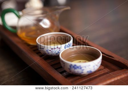 Cropped Shot Of Woman Holding Chawan With Green Oolong.