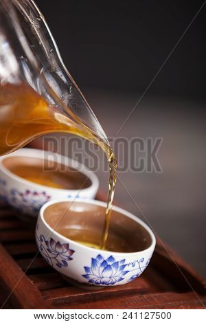 Cropped Shot Of Woman Holding Chawan With Green Oolong.