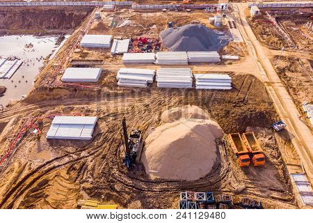 Foundation Ditch With Construction Machinery At Construction Site, High Angle View