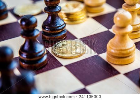 Golden Bitcoin Coins Symbolizes Elements Of Virtual Economy Or Crypto Currency With Chess Board