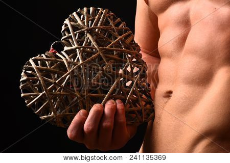 Guys Abs And Strong Chest. Athletes Body In Close Up, Hand Holding Big Rattan Heart. Male With Naked