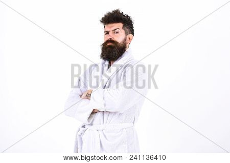 Handsome Man In A Bathrobe Isolated On White Background. Bearded Guy With Stylish Mustache Standing 