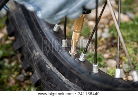 Man Motorcycle Tire Manual Air Pressure Testing Before Traveling Trip For Safety Riding Vehicle