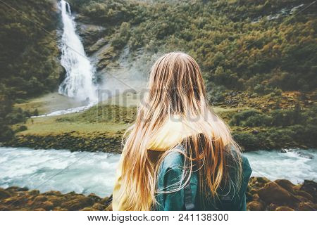 Backpacker Woman Enjoying Waterfall And Forest Landscape Traveling Alone Into The Wild Adventure Lif