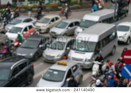 Aerial Blurred Image Of Traffic Jam In City. Urban Infrastructure Problem.