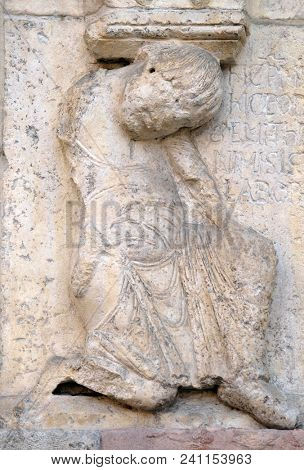 MODENA, ITALY - JUNE 04: Plate with stories from Genesis: Story about Abel and Cain, detail of relief by Wiligelmo, Modena Cathedral, Italy on June 04, 2017.