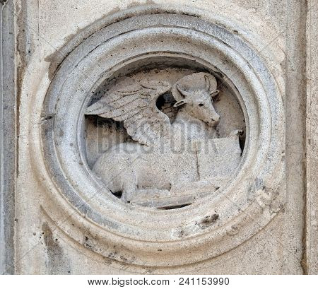 MODENA, ITALY - JUNE 04: Symbol of Saint Luke the Evangelist the marble pulpit by Jacopo e Paolo da Ferrara, dated 1501, Modena Cathedral, Italy on June 04, 2017.