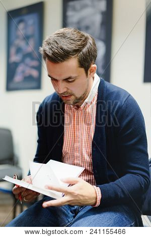 Vilnius, Lithuania - May 4, 2016: Belorussian Journalist And Novelist Sasha Filipenko Autographing H