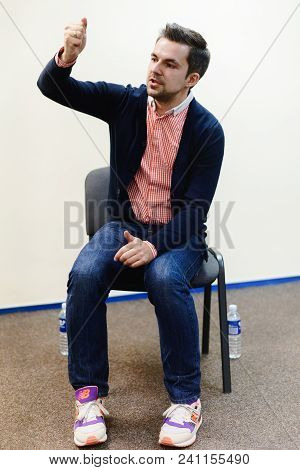 Vilnius, Lithuania - May 4, 2016: Belorussian Journalist And Novelist Sasha Filipenko Sitting In The
