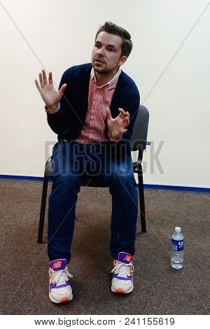 Vilnius, Lithuania - May 4, 2016: Belorussian Novelist And Journalist Sasha Filipenko Sitting On The