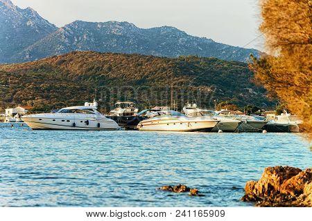 Sunrise With Boat In Costa Smeralda At Mediterranean Sea, In Sardinia, In Italy