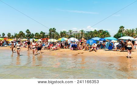 SALOU, SPAIN - AUGUST 3, 2017: Vacationers in the Llevant Beach in Salou, Spain. Salou is a major destination for sun and beach for European tourism, with more than 50,000 accommodations