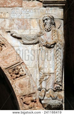 VERONA, ITALY - MAY 27: Saint John the Baptist, medieval relief on the facade of Basilica of San Zeno in Verona, Italy, on May 27, 2017.
