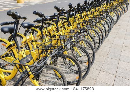 Beijing, China - April 30, 2018: Row Of Yellow Bicycles ,ofo Free Sloating Bicycle Rental In China.