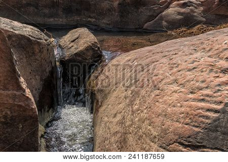 Water Flowing Through Rocks In The Canyon Of The Leba Range. Angola. Lubango.