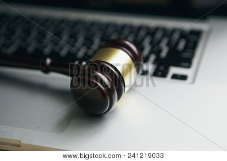 Wooden Judge Gavel On Keyboard Laptop Computer.concept Of Cyber Law Or Law About Computer.