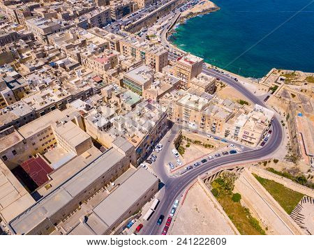 Aerial View Over Spinola Bay With Traditional Maltese Luzzu Fishing Boats