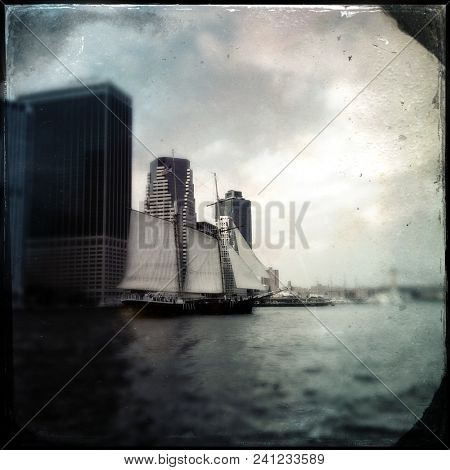 Vintage tintype filter of an old sailing ship in New York Harbor