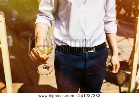 Man With A Glass Of White Wine