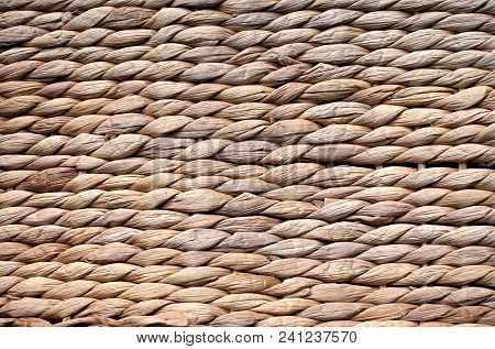 Background Texture Of Beige Or Straw Colored Wicker Or Seagrass.