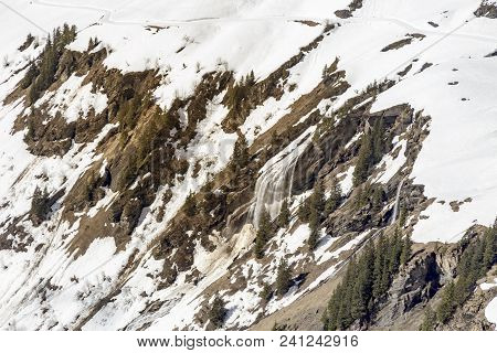 Waterfall At High Mountain From Melting Snow In Europe