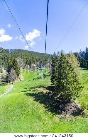 Cable Car And Tower Over Small Village On Mountain Alps, Transpotation From Grindelwald To First Pea
