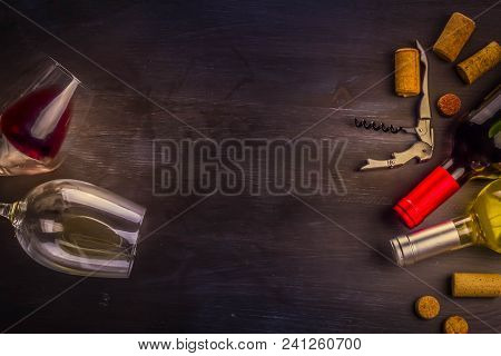 Bottle Of Red Wine And Two Wine Glasses On Table With Copy Space, Toned Image