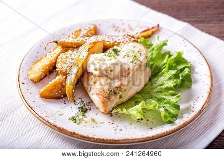 Fried Chicken Fillet With A Pear And Sauce Of Dorblu