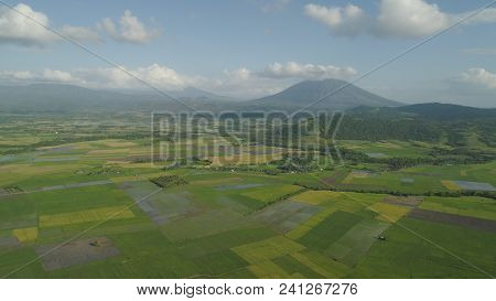 Mountain Valley With Farmland, Rice Terraces Near Mount Iriga. Aerial View Mount With Green Tropical