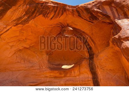 Eye Of The Eagle Big Hogan. Pothole Natural Arch Eroded In Sandstone. Navajo Tribal Park Of Monument