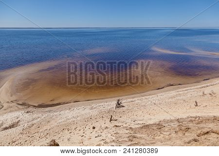 Sandy Shoreline And Sandbanks In The Water.
