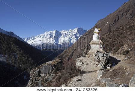 Kangtega And Thamserku Mountain View And Ancient Stone Chorten On The Road To Everest Base Camp In S