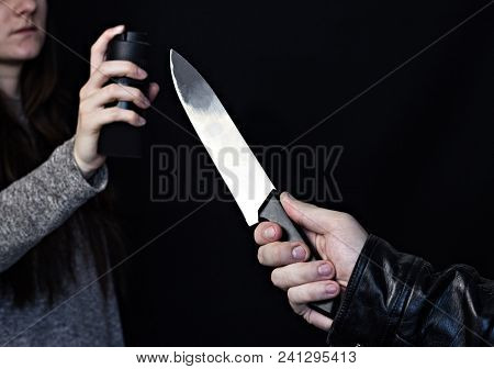 A Man With A Knife Attacks A Girl, A Girl Defends A Gas Spray, A Black Background