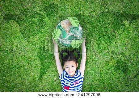 Sustainable World Environment And Csr With People Campaign Concept With Girl Kid Raising Earth On Gr