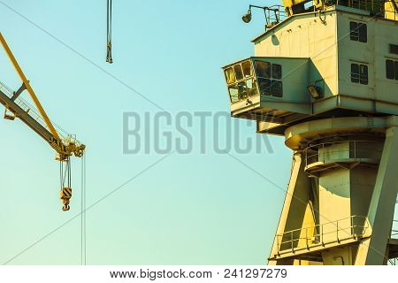 Cockpit Of Port Crane, Industry Detail. Blue Sky Background