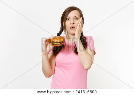 Young Beautiful Woman In Pink T-shirt With Braids Holding In Hands Burger Isolated On White Backgrou